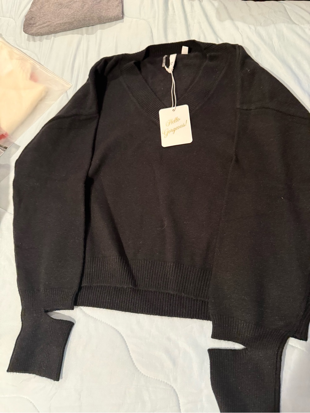 Elan Black V-Neck Women's Sweater with “cut out” wrists detail.